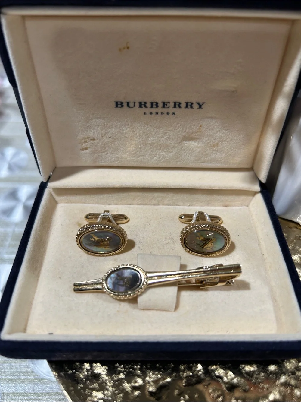 7069. Vintage Burberry London Cufflink & Tie Clip Set. Gold tone MOP w/ Box.